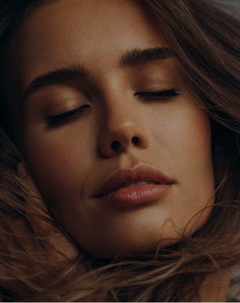 Close-up of a serene woman's face.