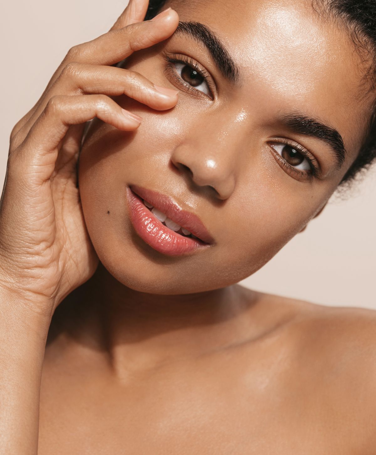 Close-up of woman with natural, glowing skin.